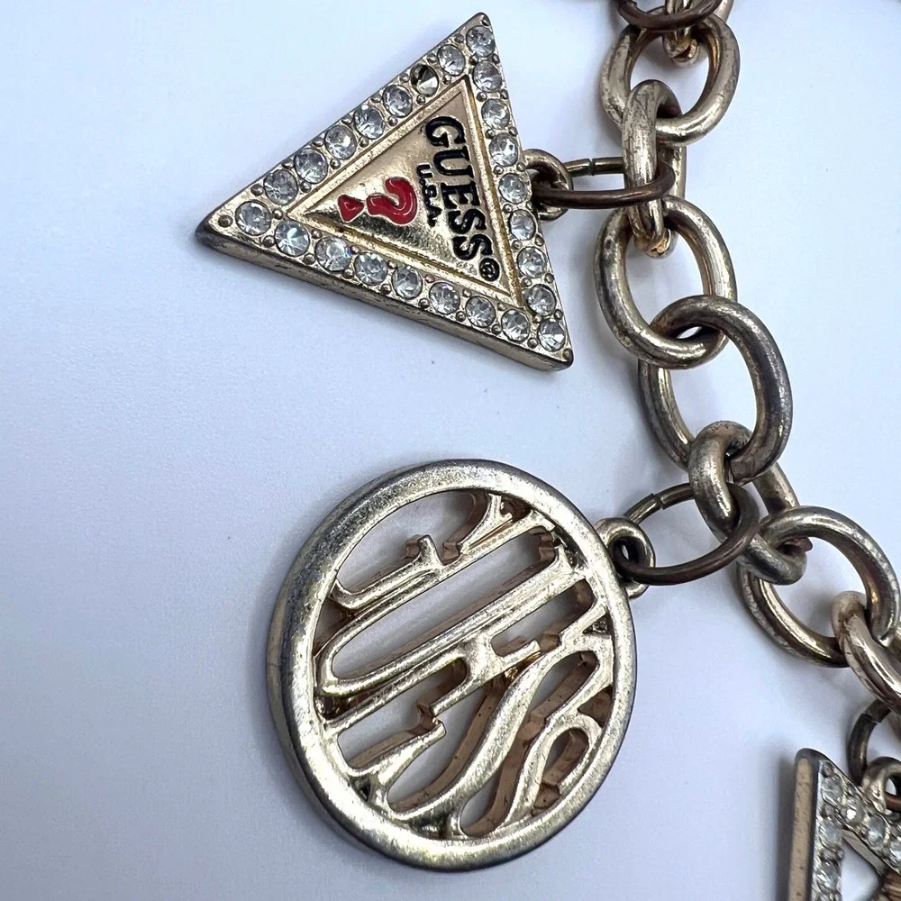GUESS Vintage Gold Tone Charm Bracelet Rhinestone Logo Est 1981 Y2K Signed